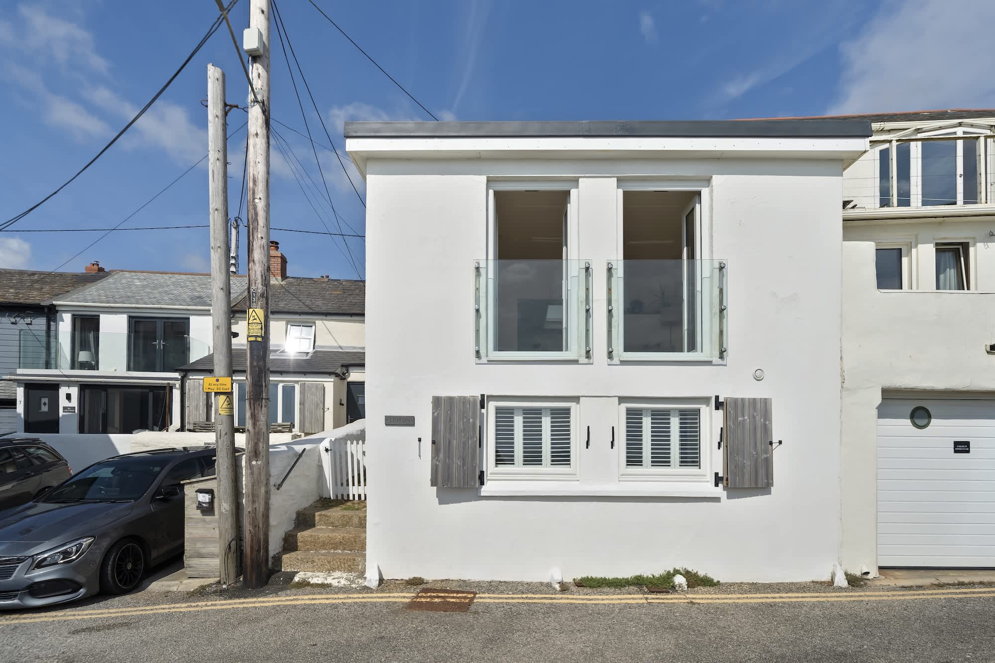 The whitewashed exterior of Triton, a former net loft in Porthleven