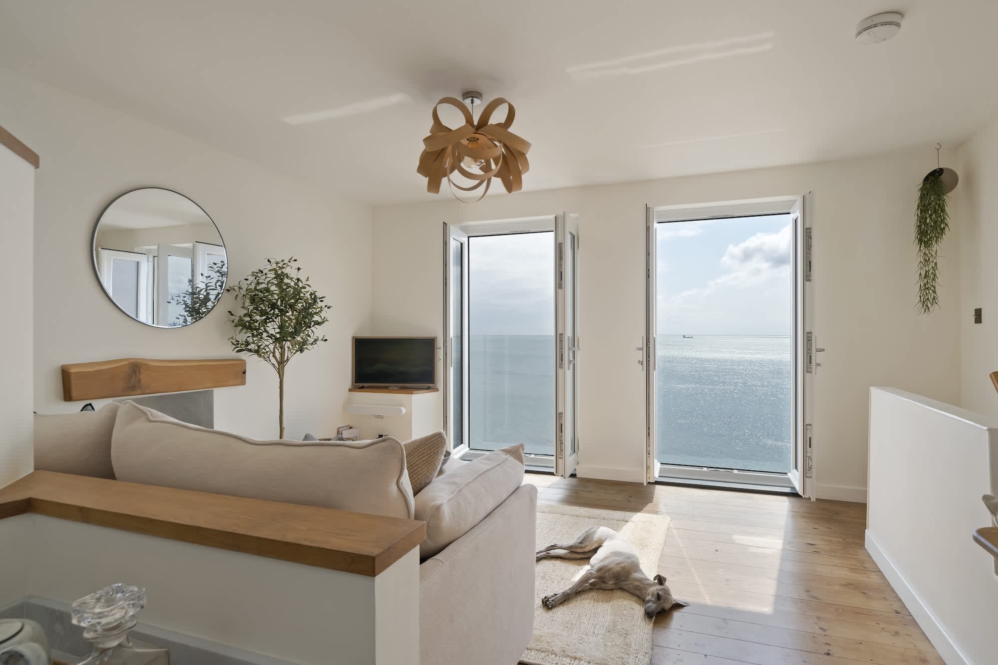 Living room windows looking straight out over Mount's Bay at Triton, Porthleven